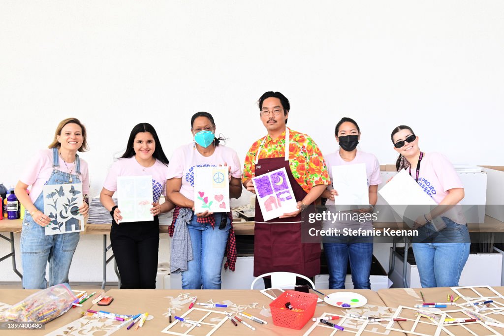 Artist Greg Ito and attendees pictured at the K.A.M.P. Family... News