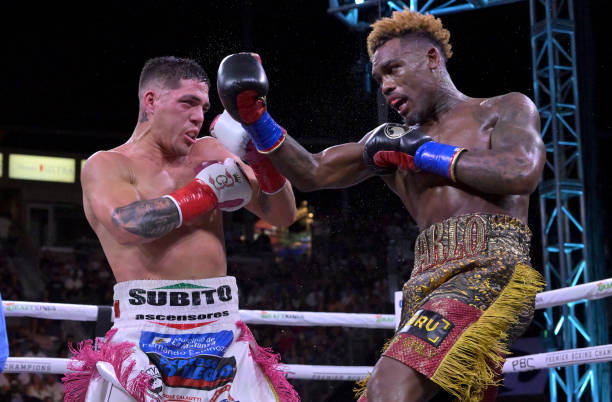 Jermell Charlo exchanges punches in the ring with Brian Castano during their super middleweight title fight at Dignity Health Sports Park on May 14,...