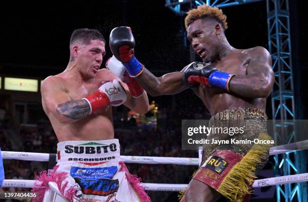 Jermell Charlo exchanges punches in the ring with Brian Castano during their super middleweight title fight at Dignity Health Sports Park on May 14,...