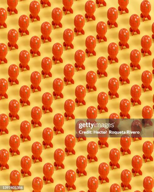 3d render of many red nuclear power on yellow background - detonator stock pictures, royalty-free photos & images