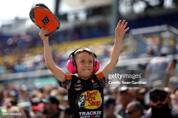 Young NASCAR fan cheers during the NASCAR Cup Series AdventHealth 400 at Kansas Speedway on May 15, 2022 in Kansas City, Kansas.
