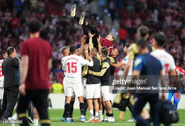 Julen Lopetegui, Head Coach of Sevilla is thrown into the air following the LaLiga Santander match between Club Atletico de Madrid and Sevilla FC at...