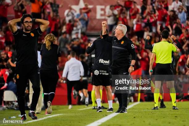 Javier Aguirre head coach of RCD Mallorca and Toni Amor assistant of RCD Mallorca celebrates his team's second goal during the LaLiga Santander match...
