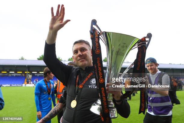 Dave Challinor, manager of Stockport County, lifts the National League trophy following the Vanarama National League match between Stockport County...