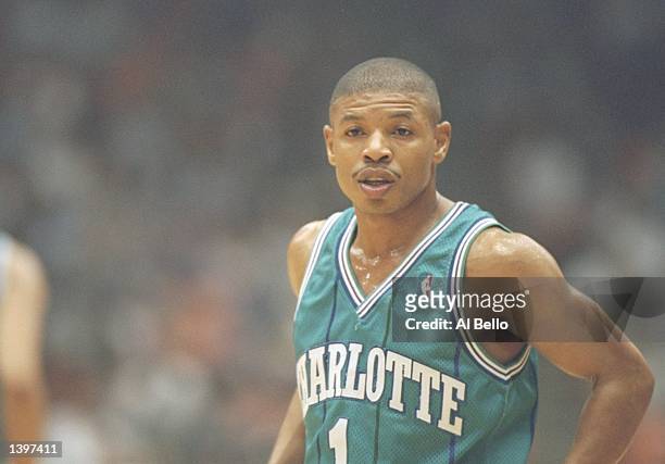 Guard Tyrone Bogues of the Charlotte Hornets stands on the court during a game against the Los Angeles Lakers at the Great Western Forum in...