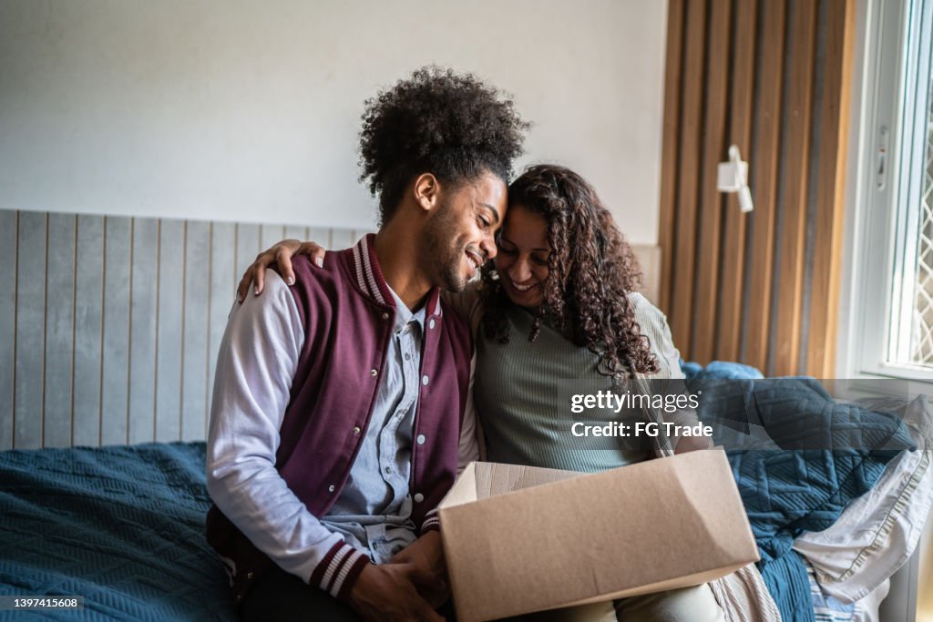 Parents Help Move Out Mother Helping Son Packing To Move Out From Parents Home High-Res Stock ...