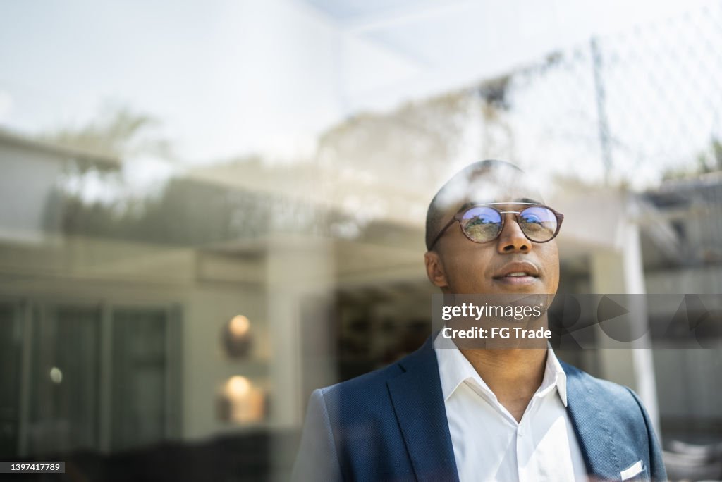 Businessman looking out of window