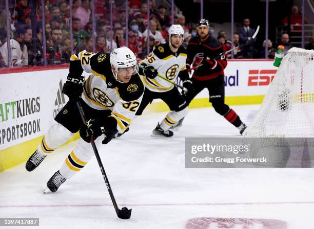 Tomas Nosek of the Boston Bruins skates with the puck through trapezoid in Game Seven of the First Round of the 2022 Stanley Cup Playoffs against the...