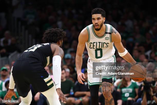 Jayson Tatum of the Boston Celtics dribbles against Wesley Matthews of the Milwaukee Bucks during the second quarter in Game Seven of the 2022 NBA...