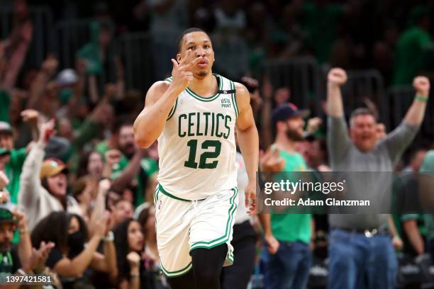 Grant Williams of the Boston Celtics reacts after making a three point basket during the third quarter against the Milwaukee Bucks in Game Seven of...