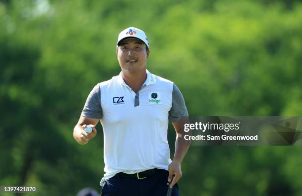 Lee of South Korea reacts to his putt on the 18th green during the final round of the AT&T Byron Nelson at TPC Craig Ranch on May 15, 2022 in...