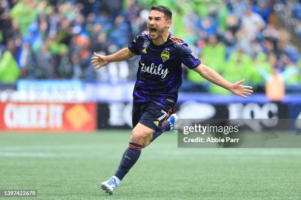 Cristian Roldan of Seattle Sounders celebrates after scoring a goal against Minnesota United to take a 2-1 lead during the second half at Lumen Field...