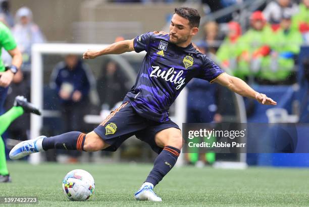 Cristian Roldan of Seattle Sounders shoots and scores a goal against Minnesota United to take a 2-1 lead during the second half at Lumen Field on May...