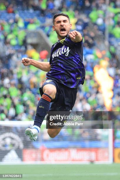 Cristian Roldan of Seattle Sounders celebrates after scoring a goal against Minnesota United to take a 2-1 lead during the second half at Lumen Field...