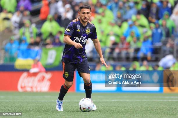 Cristian Roldan of Seattle Sounders controls the ball against Minnesota United during the second half at Lumen Field on May 15, 2022 in Seattle,...