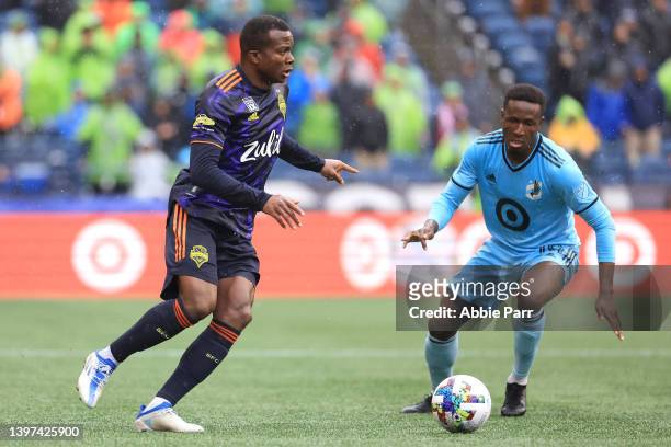 Nouhou of Seattle Sounders controls the ball against Romain Métanire of Minnesota United during the first half at Lumen Field on May 15, 2022 in...