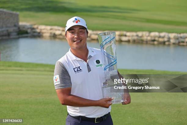 Lee of South Korea poses with the trophy after winning on the 18th green during the final round of the AT&T Byron Nelson at TPC Craig Ranch on May...