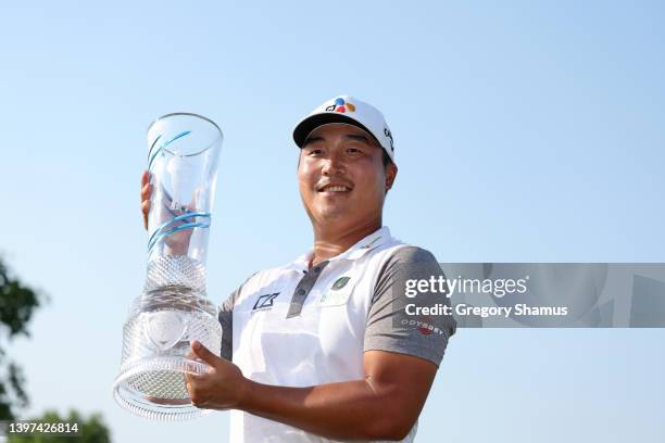 Lee of South Korea poses with the trophy after winning on the 18th green during the final round of the AT&T Byron Nelson at TPC Craig Ranch on May...