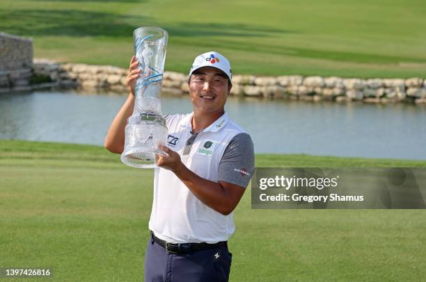 Lee of South Korea poses with the trophy after winning on the 18th green during the final round of the AT&T Byron Nelson at TPC Craig Ranch on May...