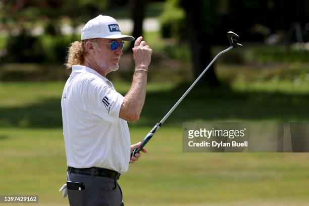 Miguel Angel Jimenez of Spain reacts after making birdie on the eighth green during the final round of the Regions Tradition at Greystone Golf and...