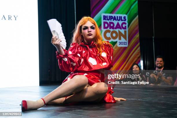 Child walks the catwalk during 'Kid's Fashion Show: Presented by LA Public Library ' on the 'House of Love' main stage during 'RuPaul's DragCon' at...