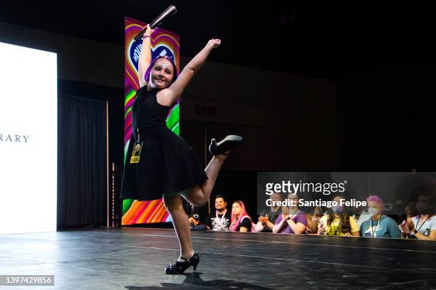 Child walks the catwalk during 'Kid's Fashion Show: Presented by LA Public Library ' on the 'House of Love' main stage during 'RuPaul's DragCon' at...