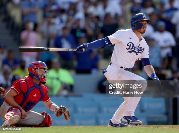 Gavin Lux of the Los Angeles Dodgers hits a walk off double in front of Garrett Stubbs of the Philadelphia Phillies, for a 5-4 win, during the bottom...