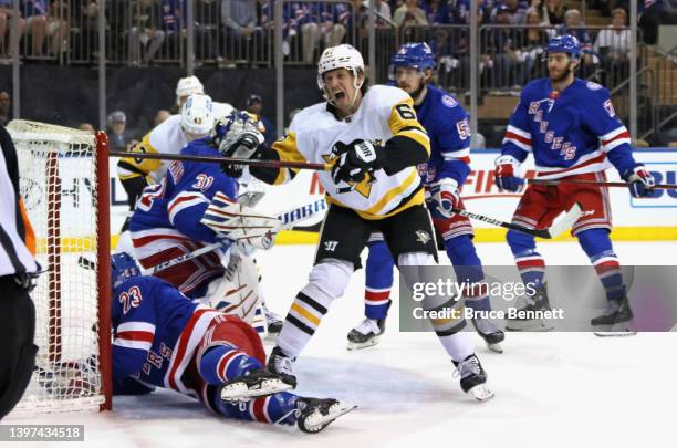 Rickard Rakell of the Pittsburgh Penguins scores a powerplay goal at 18:51 of the first period against Igor Shesterkin of the New York Rangers in...