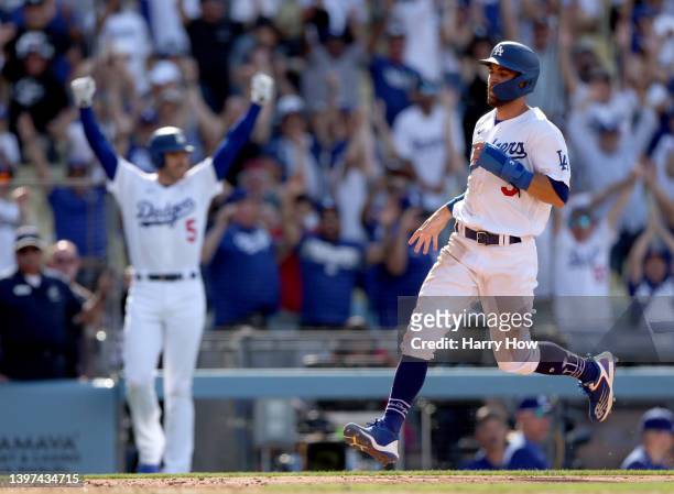 Chris Taylor of the Los Angeles Dodgers runs home to score the game winning run in front of Freddie Freeman, from a Gavin Lux double, for a 5-4 win...