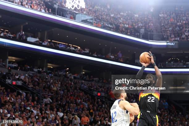 Deandre Ayton of the Phoenix Suns shoots the ball against Maxi Kleber of the Dallas Mavericks during the first half in Game Seven of the 2022 NBA...