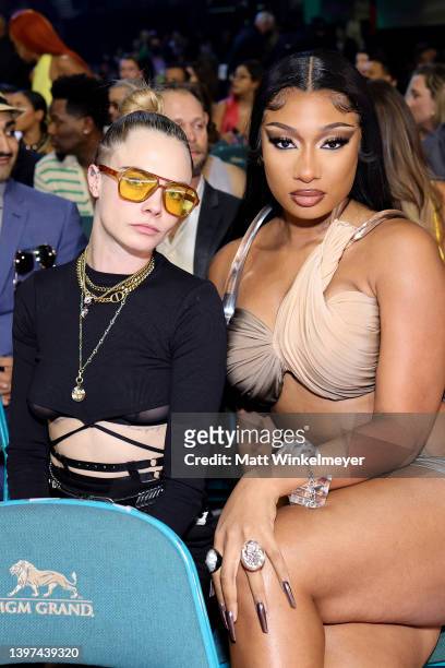 Cara Delevingne and Megan Thee Stallion attend the 2022 Billboard Music Awards at MGM Grand Garden Arena on May 15, 2022 in Las Vegas, Nevada.