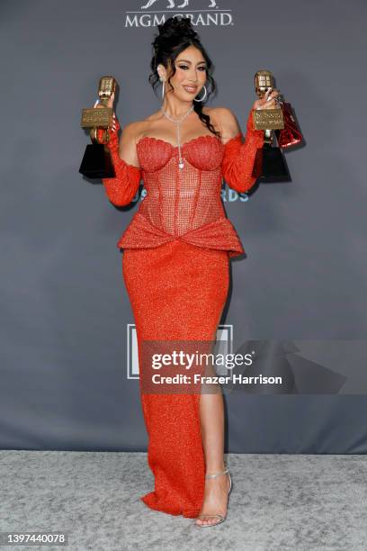Kali Uchis poses backstage with awards for Top Latin Female Artist and Top Latin Song during athe 2022 Billboard Music Awards at MGM Grand Garden...