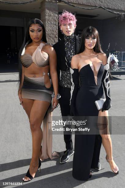 Megan Thee Stallion, Machine Gun Kelly and Megan Fox attend the 2022 Billboard Music Awards at MGM Grand Garden Arena on May 15, 2022 in Las Vegas,...