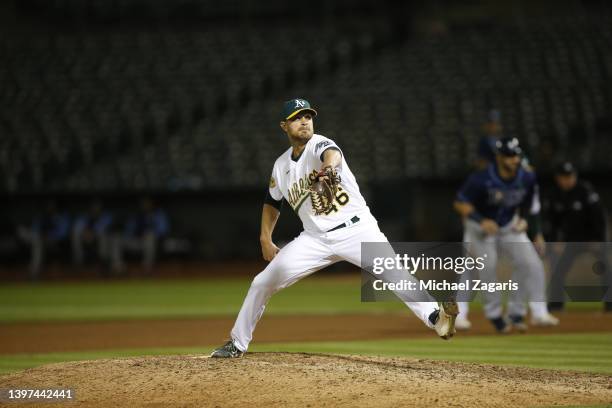 Justin Grimm of the Oakland Athletics pitches during the game against the Tampa Bay Rays at RingCentral Coliseum on May 3, 2022 in Oakland,...