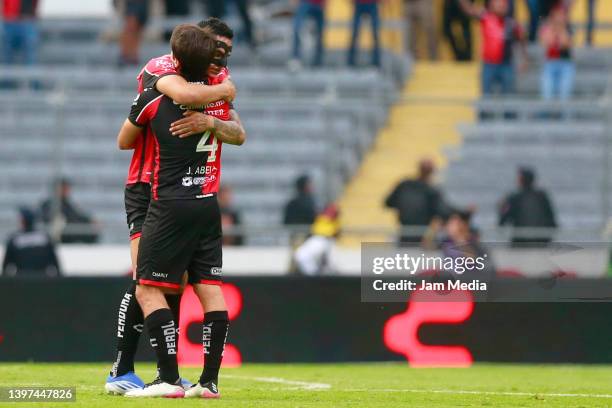 Anderson Santamaria and Jose Abella of Atlas celebrate after the quartefinals second leg match between Atlas and Chivas as part of the Torneo Grita...