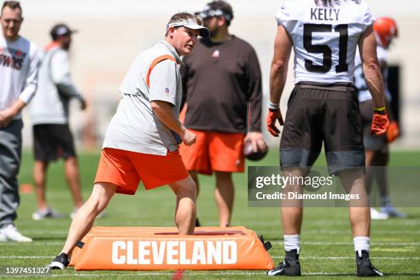 Linebackers coach Jason Tarver of the Cleveland Browns directs a drill during the first day of Cleveland Browns rookie mini camp at CrossCountry...