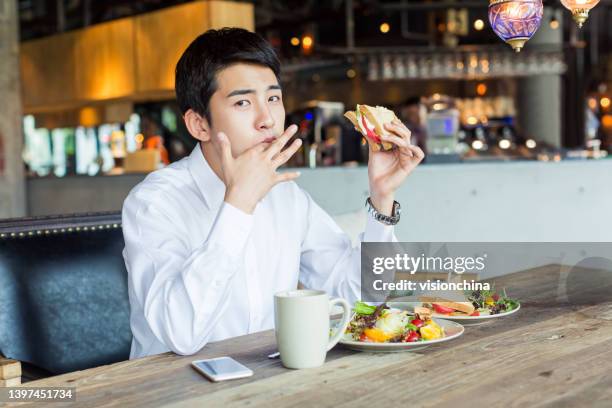 west restaurant young people - west asian ethnicity stockfoto's en -beelden