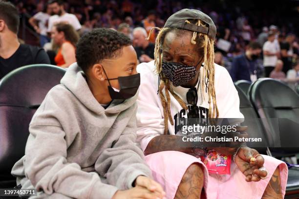 Rapper Lil Wayne attends Game Seven of the 2022 NBA Playoffs Western Conference Semifinals between the Dallas Mavericks and the Phoenix Suns at...