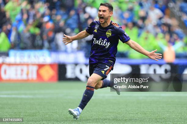 Cristian Roldan of Seattle Sounders celebrates after scoring a goal against Minnesota United to take a 2-1 lead during the second half at Lumen Field...