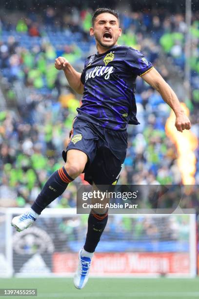 Cristian Roldan of Seattle Sounders celebrates after scoring a goal against Minnesota United to take a 2-1 lead during the second half at Lumen Field...