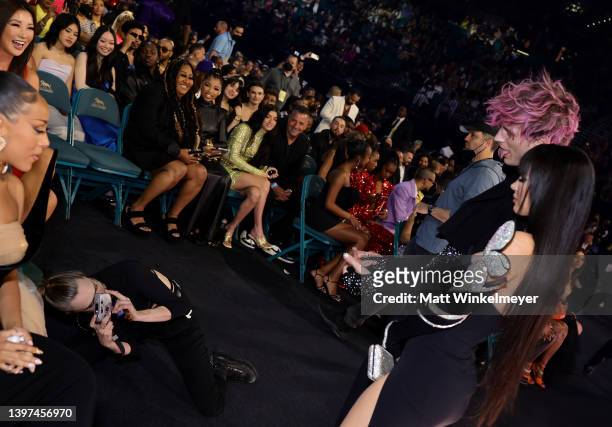Cara Delevingne photographs Machine Gun Kelly and Megan Fox during the 2022 Billboard Music Awards at MGM Grand Garden Arena on May 15, 2022 in Las...