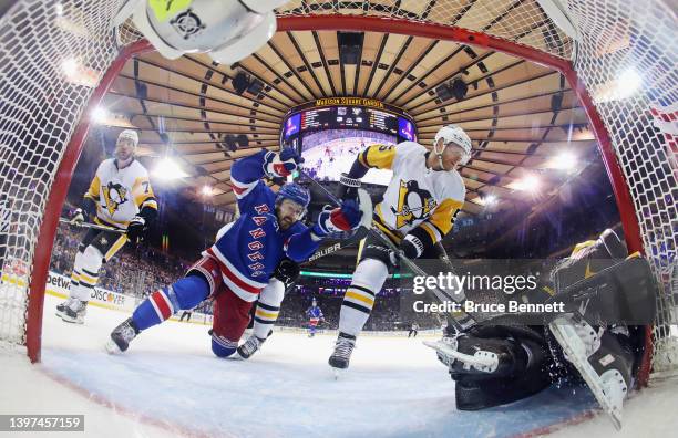 Tyler Motte of the New York Rangers is stopped by Mike Matheson and Tristan Jarry of the Pittsburgh Penguins in Game Seven of the First Round of the...