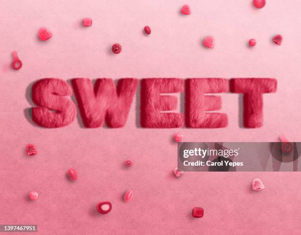 sweet  word written in sugar background - süßgebäck teilchen stock-fotos und bilder