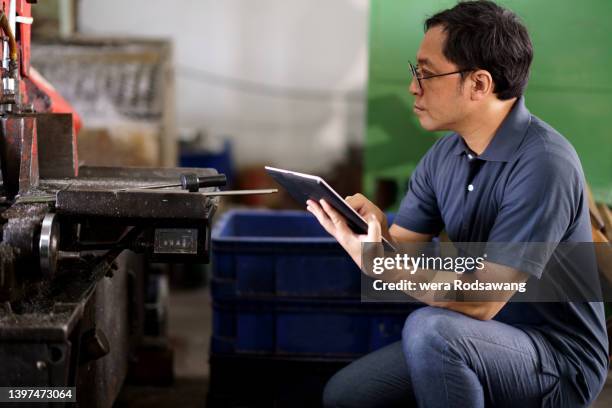 engineer inspecting wastes material in manufacturing system in industrial - nuclear waste management stock pictures, royalty-free photos & images