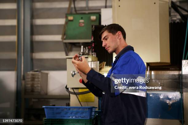 engineer inspecting production reduce manufacturing waste - nuclear waste management stock pictures, royalty-free photos & images