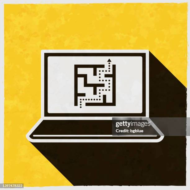 laptop with maze. icon with long shadow on textured yellow background - teaser stock illustrations