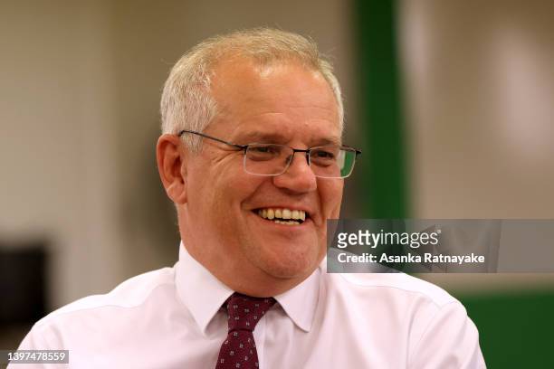 Prime Minister Scott Morrison speaks to local community members during afternoon tea at Railway Halls on May 16, 2022 in Cairns, Australia. The...