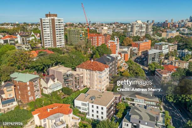 old and new apartment buildings houses on hill, city skyline - housing problems stock pictures, royalty-free photos & images