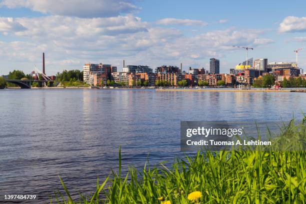 view of tampere city over the lake pyhäjärvi in finland in the summer. - tampere foto e immagini stock