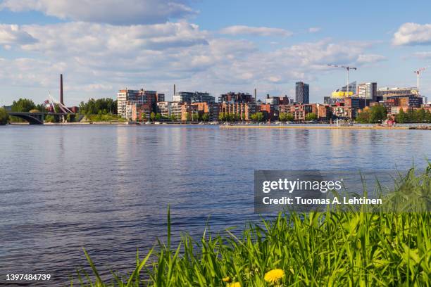 view of tampere city over the lake pyhäjärvi in finland in the summer. - tampere finland stock pictures, royalty-free photos & images